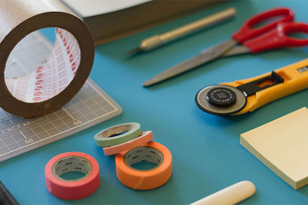 Tape, scissors, and rulers for measuring